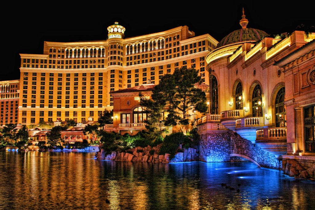 Luxury casino hotel illuminated at night, creating an elegant setting for a formal casino night event.
