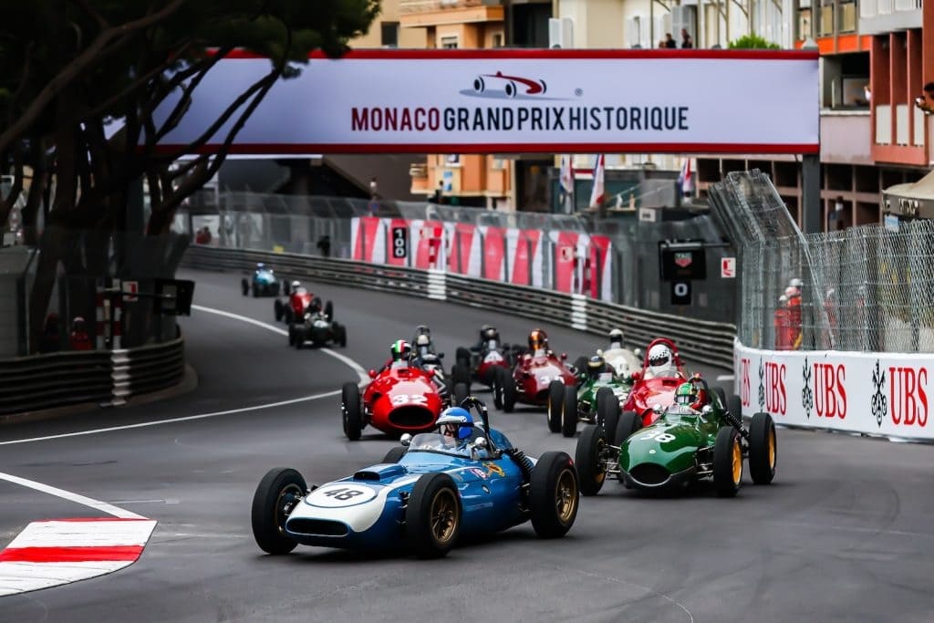 Historic Formula One cars racing through the streets of Monaco during the Monaco Grand Prix Historique.