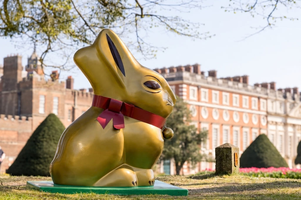 Large Gold Bunny displayed in the gardens of Hampton Court Palace during Easter weekend.