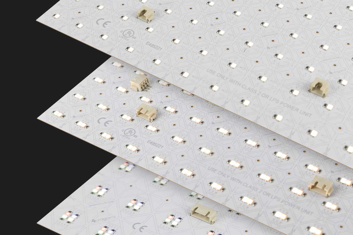 Three stacked LED light sheets with components and connectors on a black background.