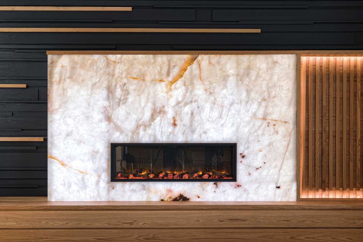 Modern electric fireplace set in a white marble surround with black and wooden wall accents. backlit by auragami light sheets