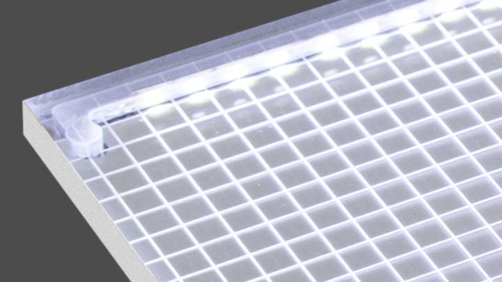 Close-up of an illuminated grid panel with white LED lights glowing along the edges.