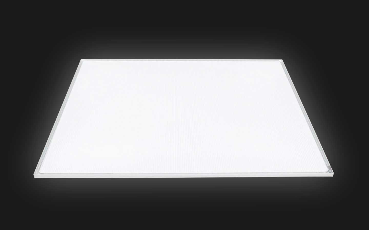Rectangular white LED panel light glowing against a dark background.