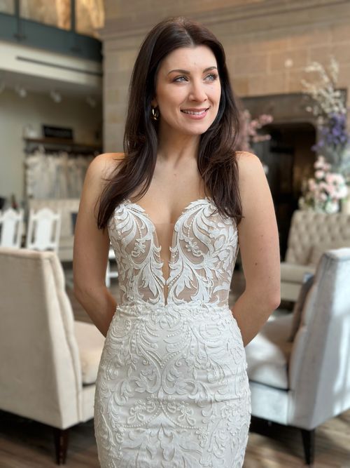 Romantic fit and flare wedding gown with illusion neckline at bridal boutique in Fredericksburg Virginia