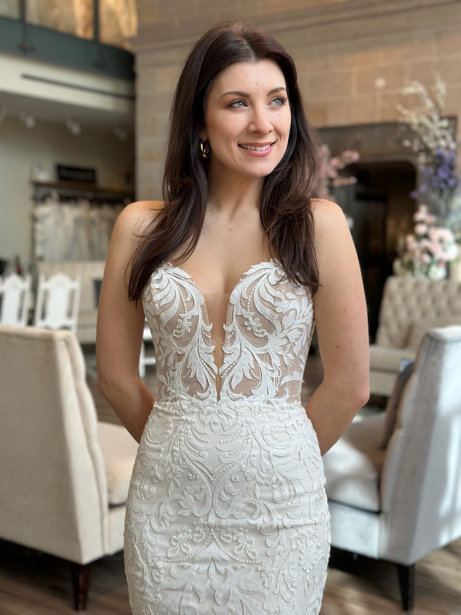 Romantic fit and flare wedding gown with illusion neckline at bridal boutique in Fredericksburg Virginia