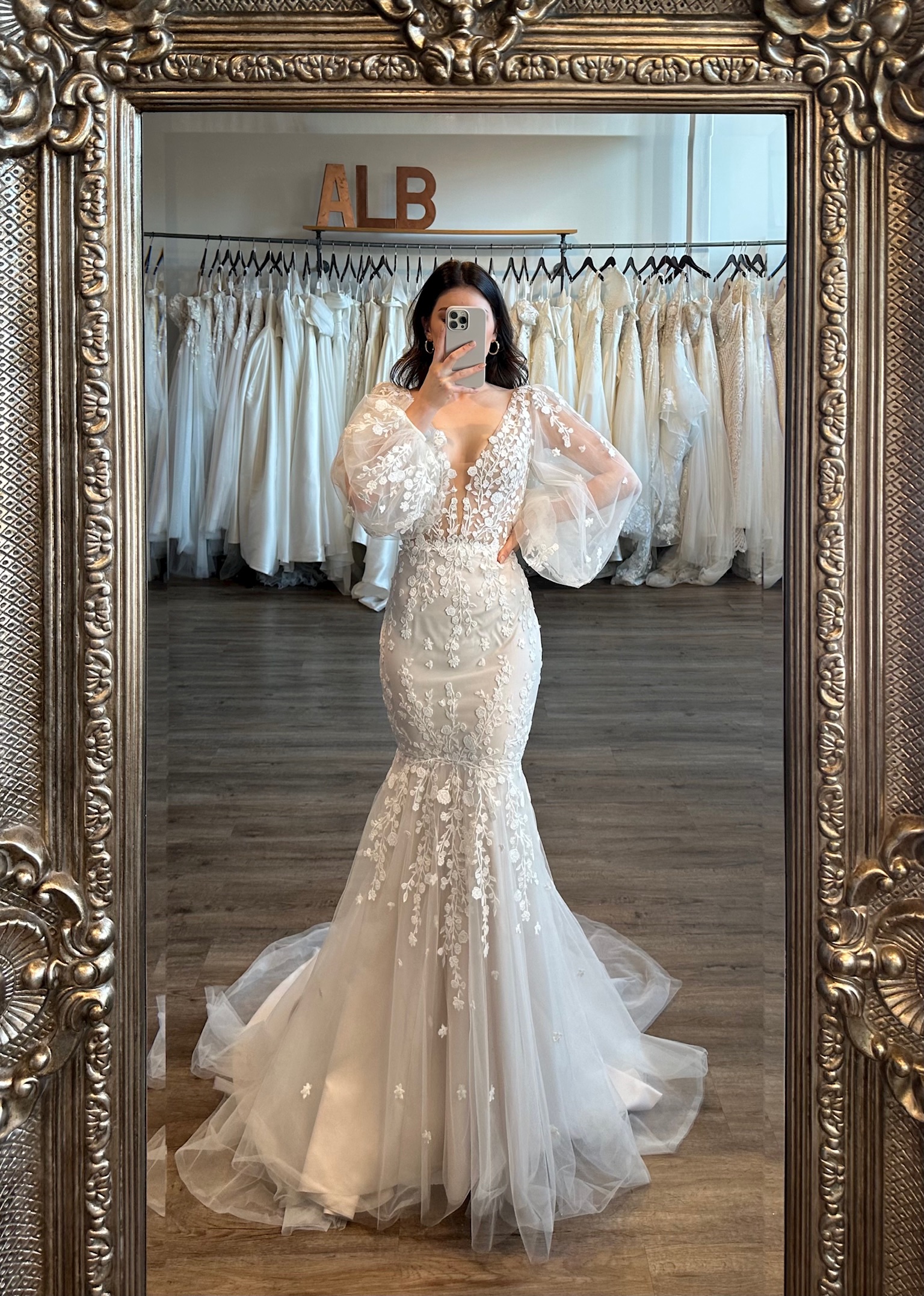 Elegant puff sleeve fit and flare wedding dress mirror selfie at Ava Laurénne Bride