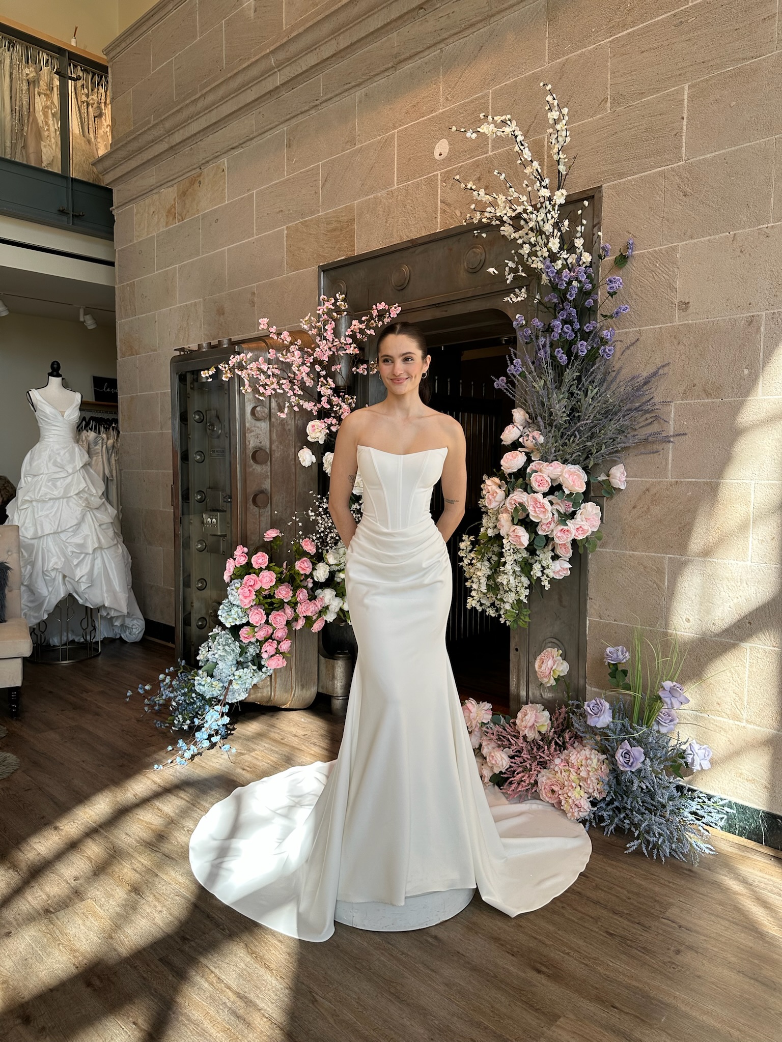 Modern fit and flare bridal gown with floral appliqué in Fredericksburg Virginia bridal boutique