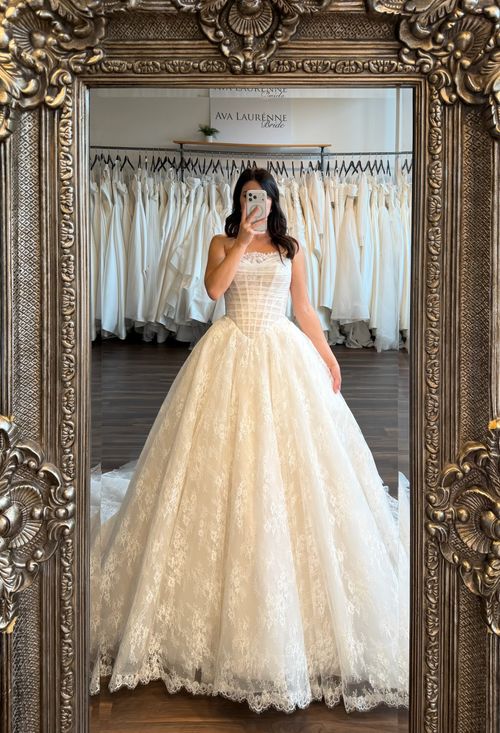 Minimalist floral jacquard ball gown wedding dress mirror selfie at Fredericksburg bridal shop