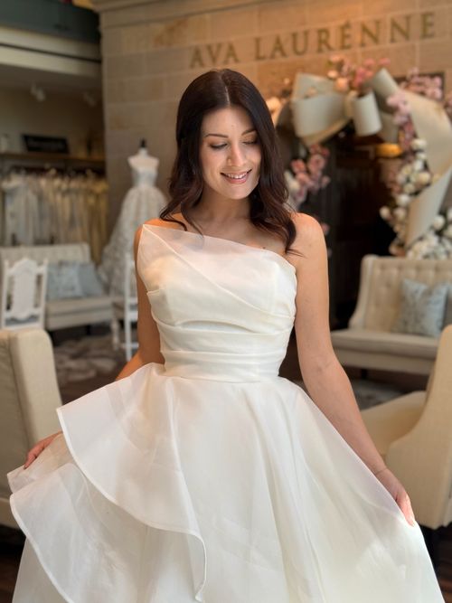 Sophisticated long sleeve high neckline wedding dress for a classic bridal look