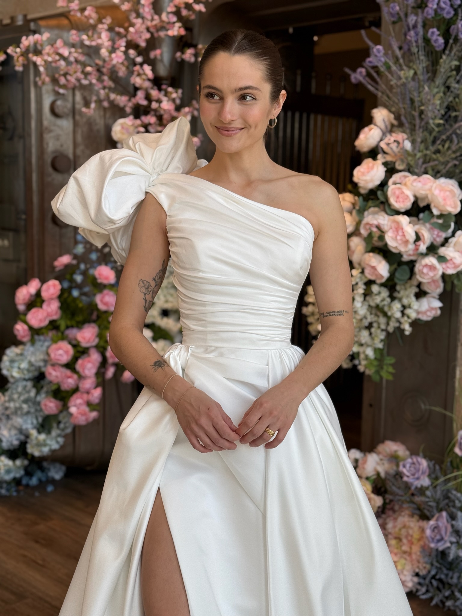 High neckline wedding gown featuring intricate floral lace and romantic bridal styling