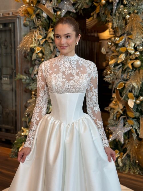 Elegant high neckline lace wedding dress with long sleeves at Ava Laurénne Bride in Fredericksburg Virginia