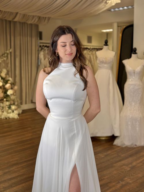 High neckline wedding dresses at Ava Laurénne Bride in Fredericksburg Virginia featuring lace, long sleeves, and timeless bridal elegance