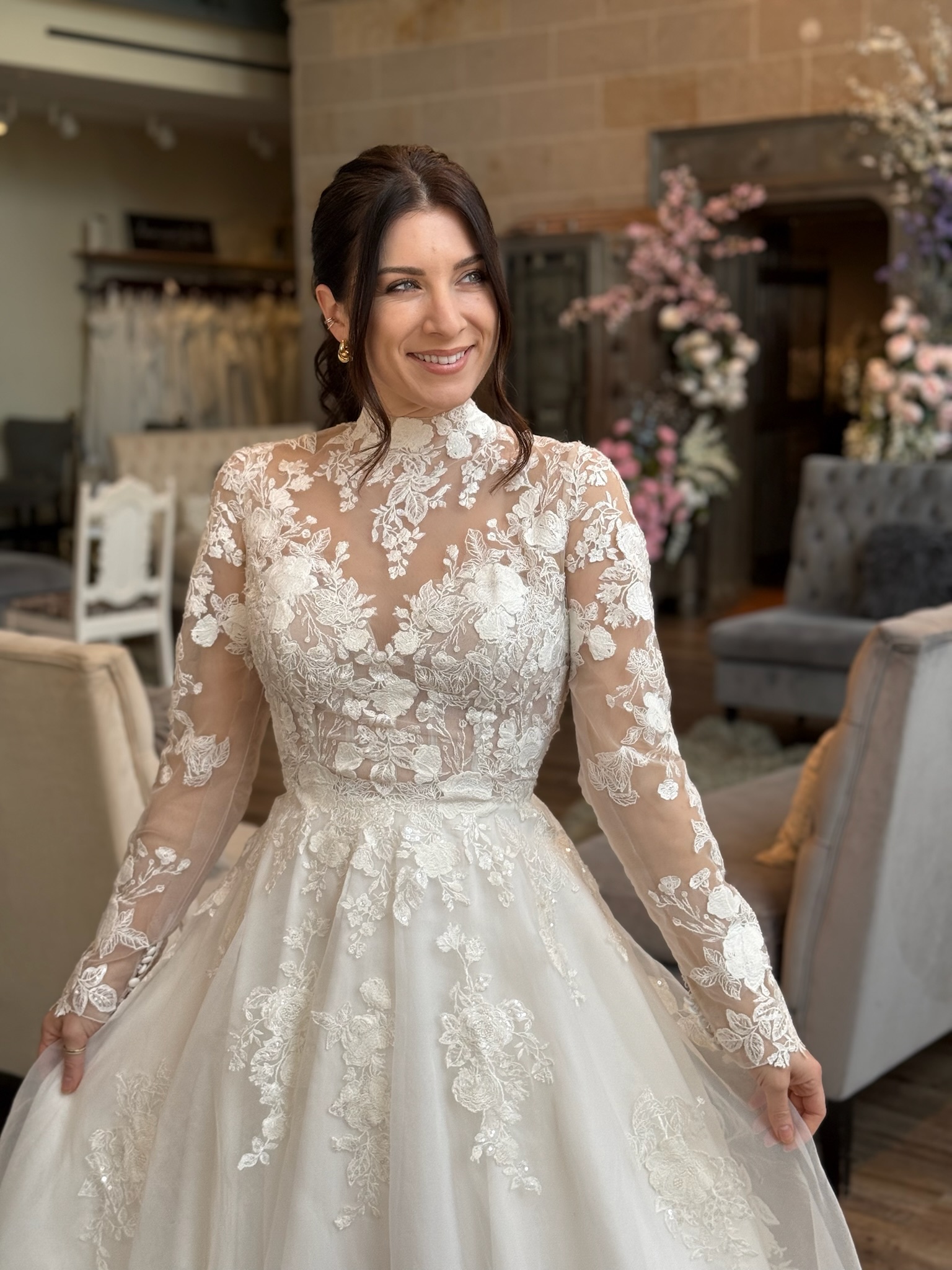 Timeless high neckline wedding dress with dramatic train and elegant lace sleeves