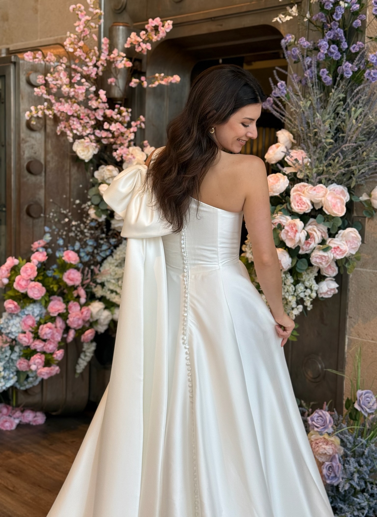 Elegant bridal gown with high neckline and long lace sleeves at Ava Laurénne Bride