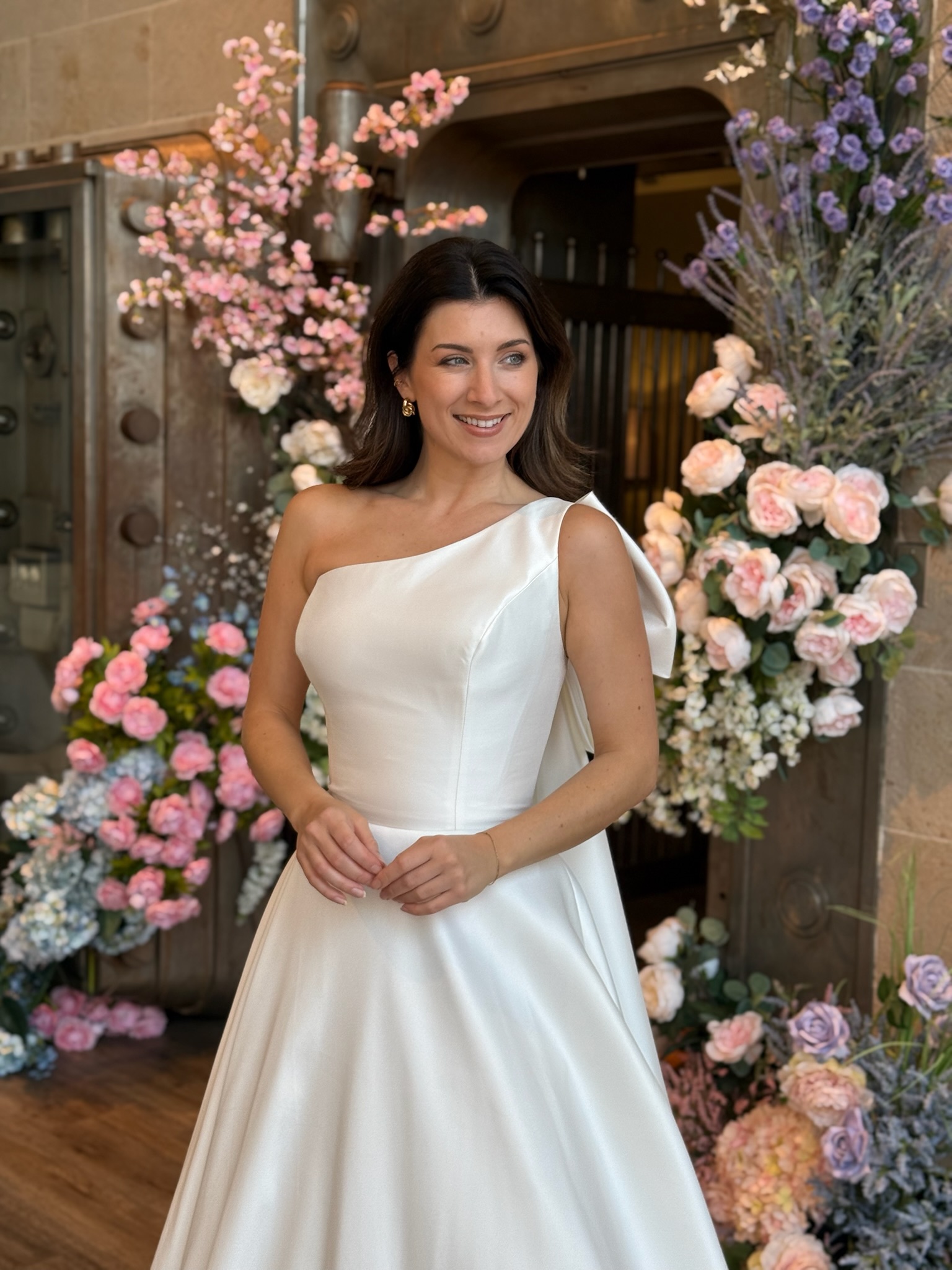 Elegant bridal gown with high neckline and long lace sleeves at Ava Laurénne Bride