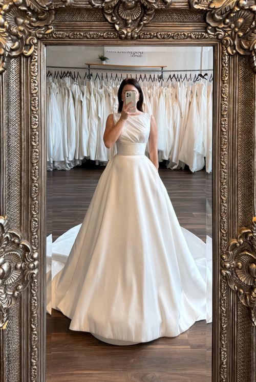 Modern bridal style with a high neckline wedding dress and sophisticated silhouette at Ava Laurénne Bride