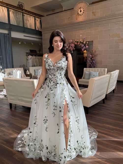 Bride wearing a blush floral embroidered wedding dress at Ava Laurènne Bride in Fredericksburg Virginia