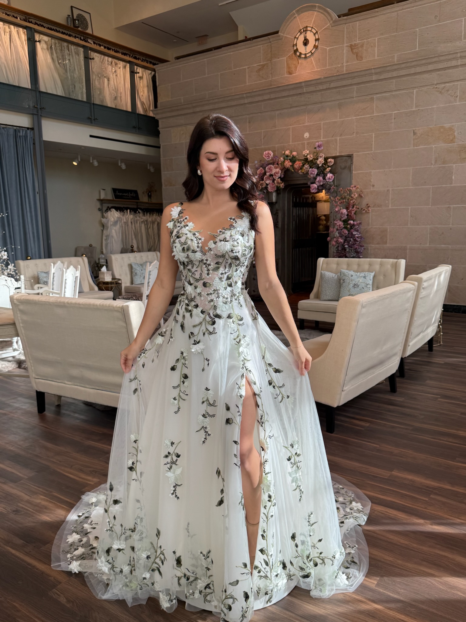 Bride wearing a blush floral embroidered wedding dress at Ava Laurènne Bride in Fredericksburg Virginia