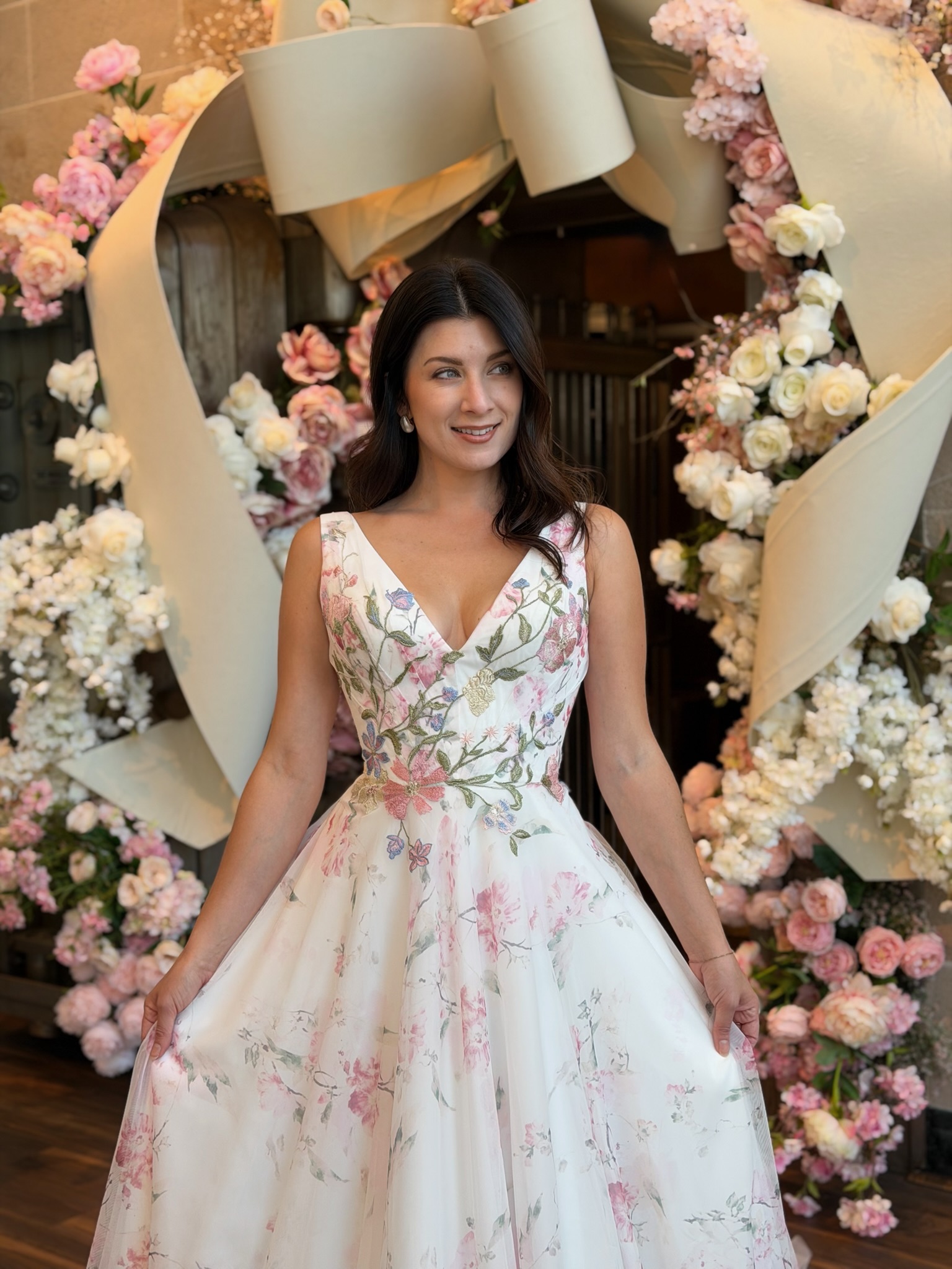 Colorful bridal ball gown with floral embroidery displayed at Ava Laurènne Bride