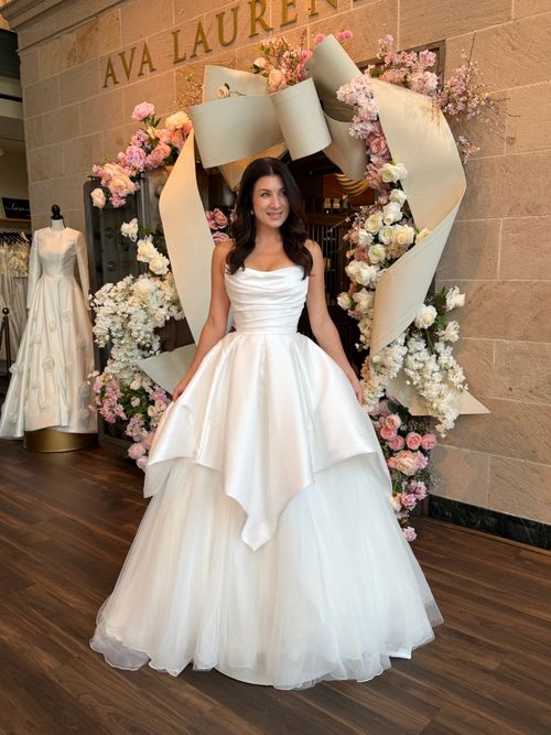 Bride wearing a timeless strapless wedding gown at Ava Laurènne Bride in Virginia