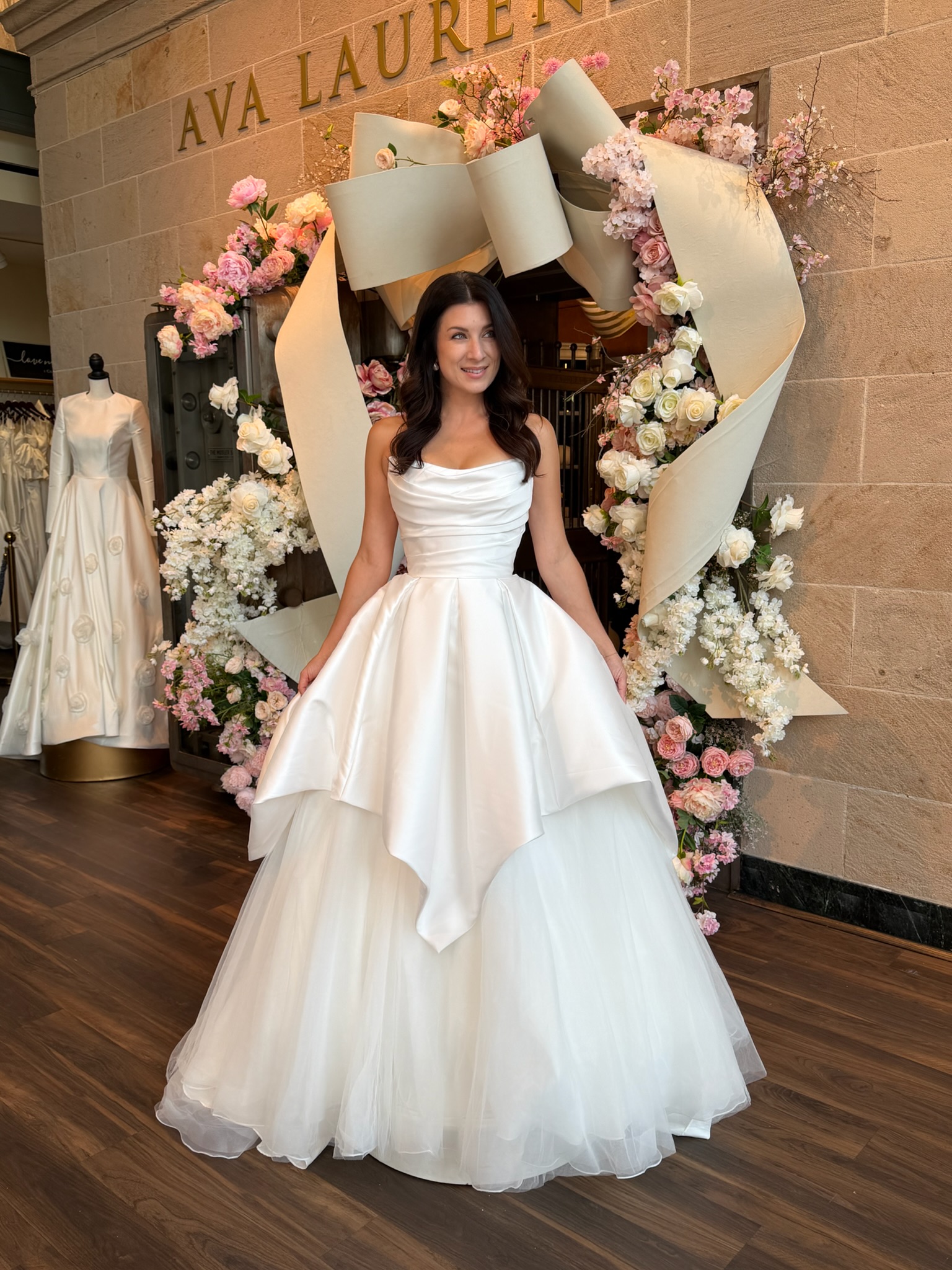 Bride wearing a timeless strapless wedding gown at Ava Laurènne Bride in Virginia