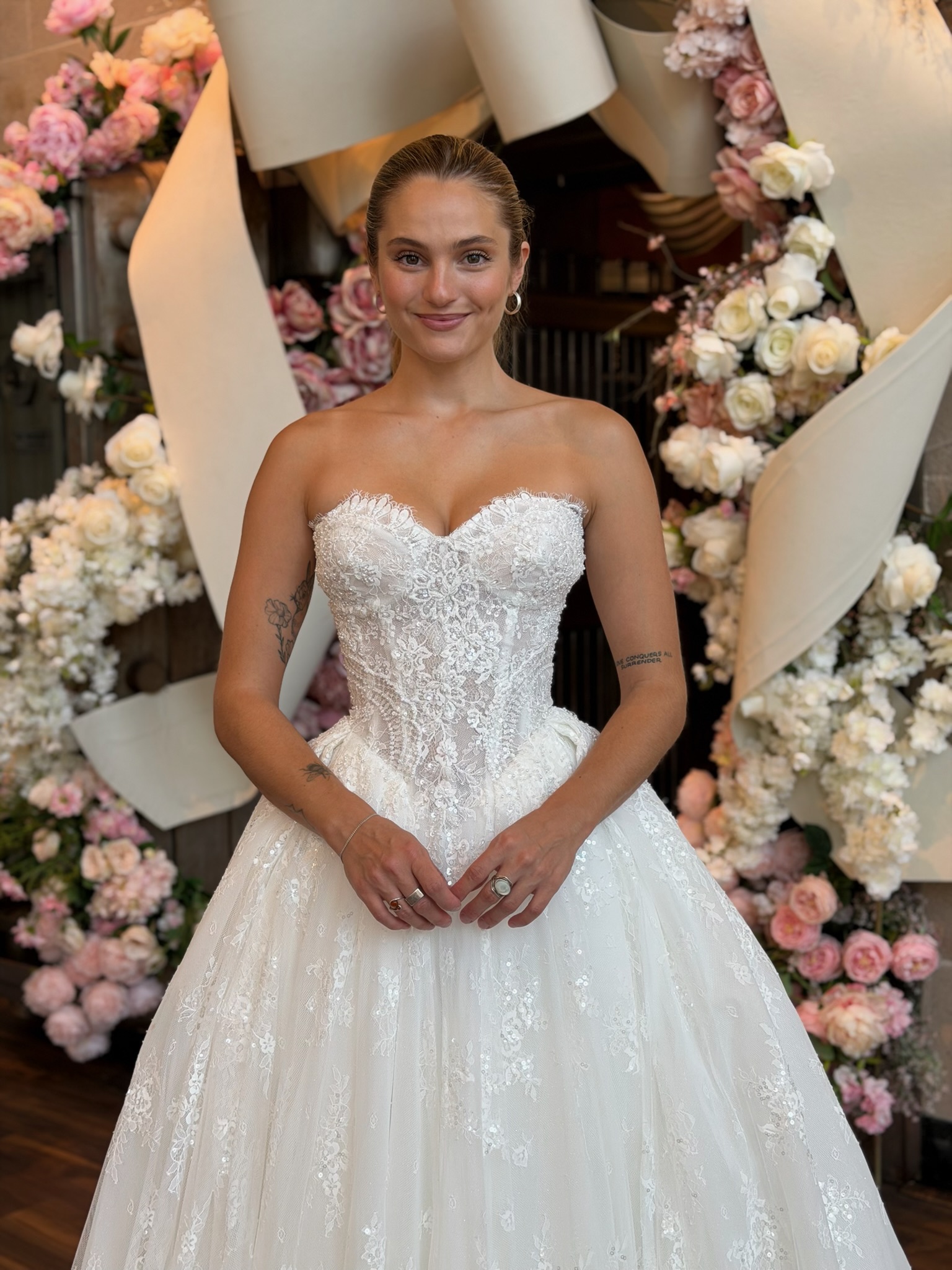 Bride wearing a structured strapless ball gown in the Ava Laurènne Bride Forever Lounge