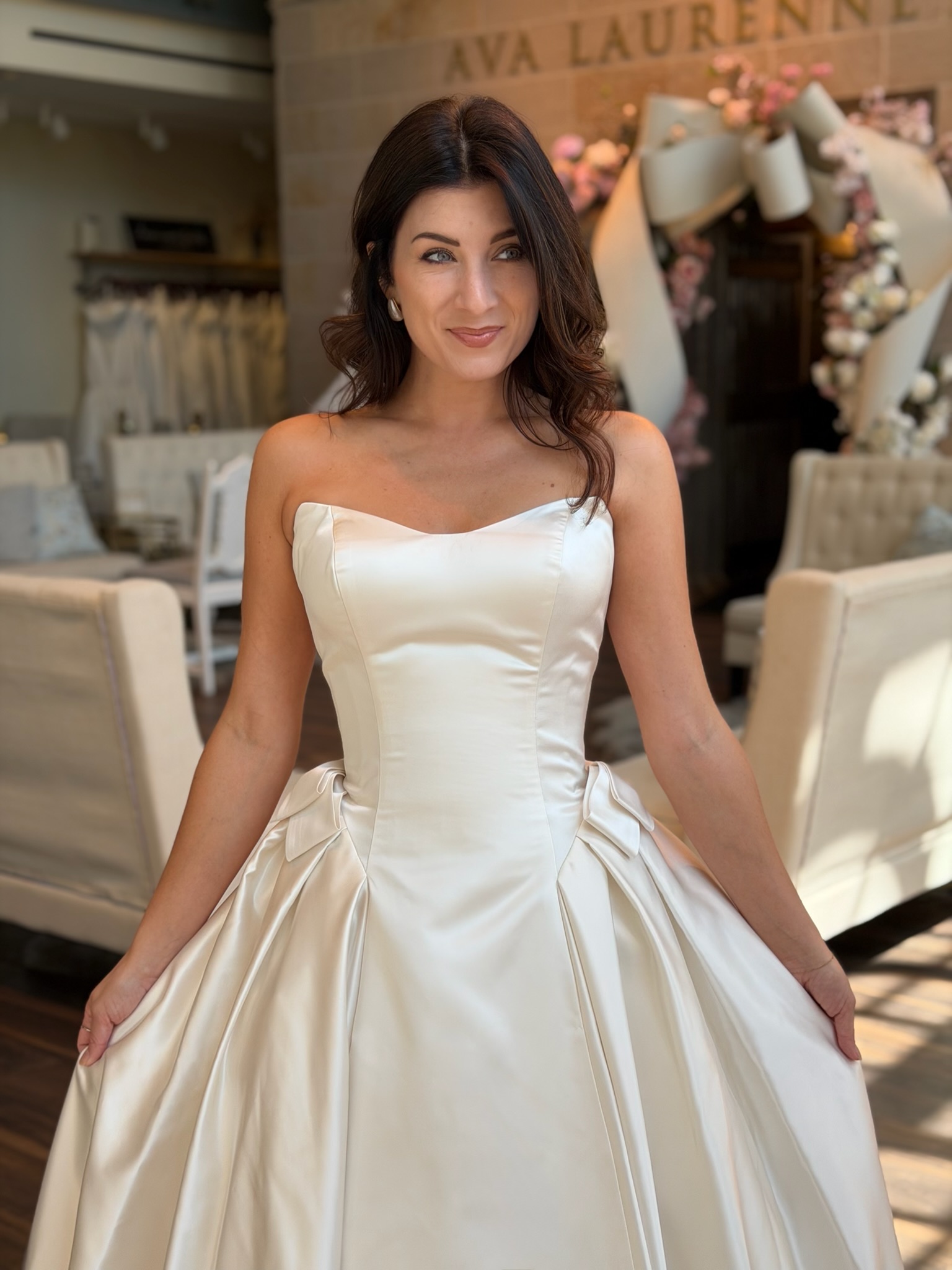 Strapless satin ball gown wedding dress inside Ava Laurènne Bride Fredericksburg VA
