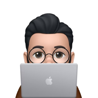 Emoji of a person with glasses and black hair peeking over a silver Apple laptop.
