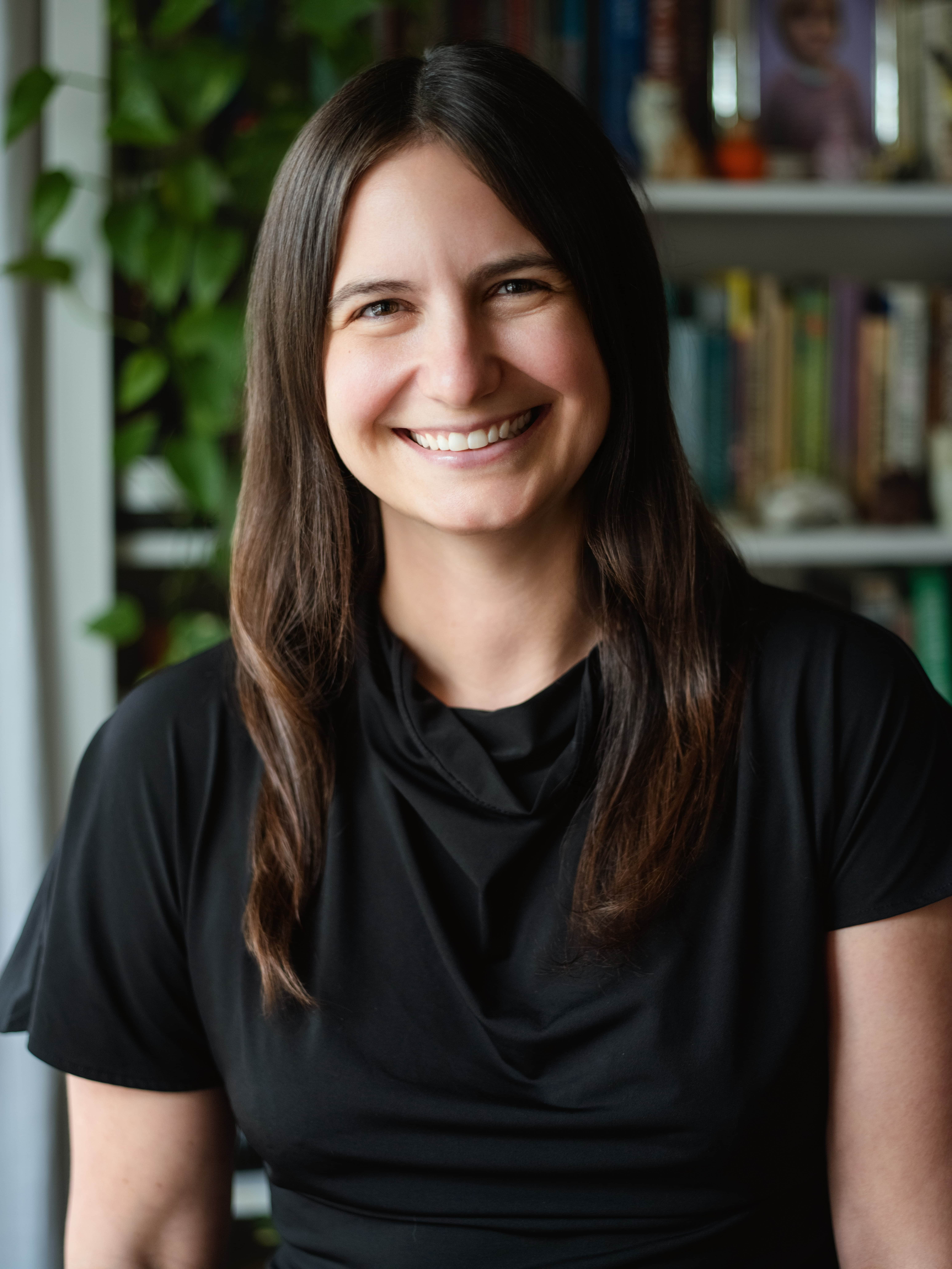 Jen Mayer, AFC® portrait wearing a black sweater.