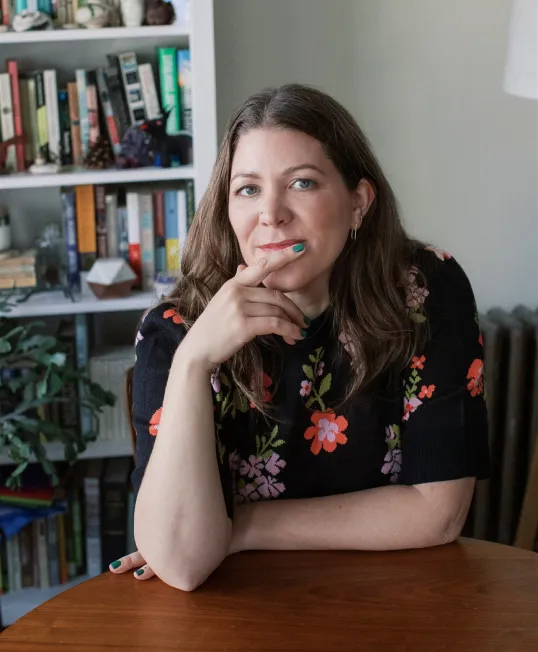 Jen Mayer, AFC® portrait wearing a black sweater.