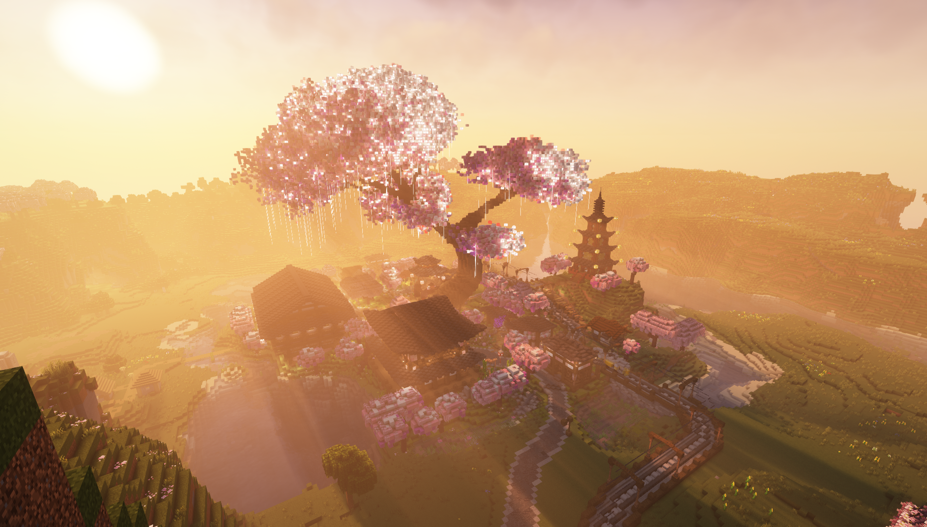 Minecraft village at sunset with pink cherry blossom trees and a multi-tiered pagoda.