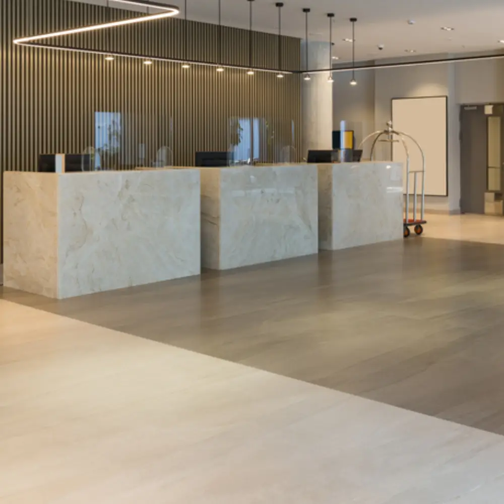 Spacious cafe interior featuring red tiled flooring, timber counters, and a chef behind the service area.