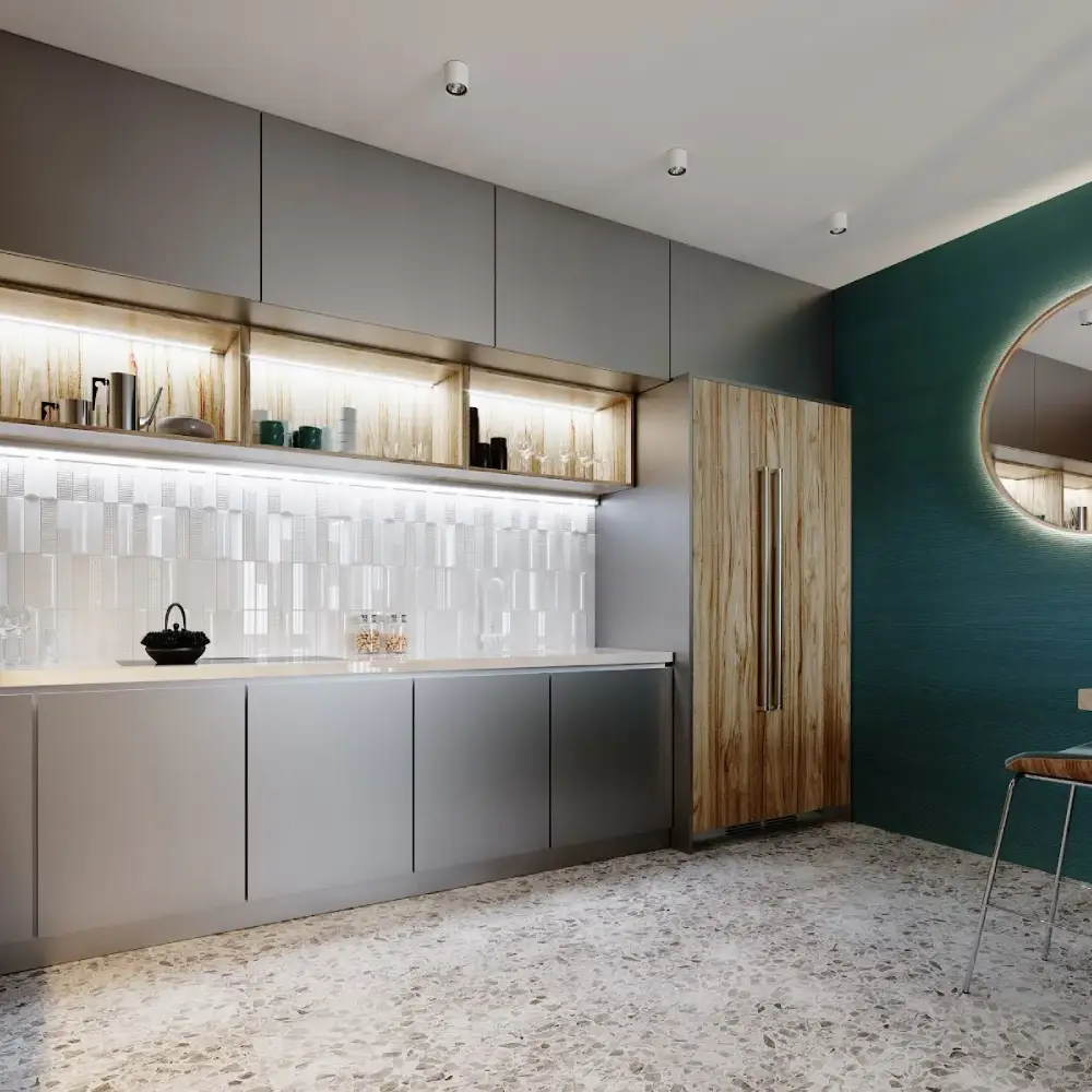 Modern kitchen with terrazzo flooring, wood and metal cabinetry, a green accent wall, and a round illuminated mirror.