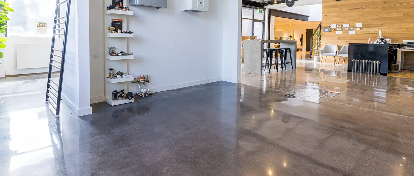 Polished concrete flooring in a modern commercial space with a high-gloss finish
