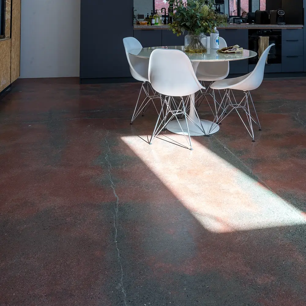 Durable concrete flooring with exposed aggregate in a busy hospitality venue.