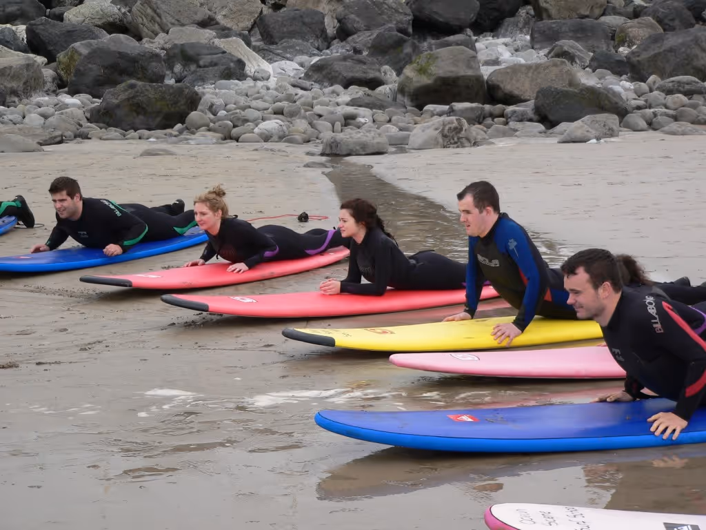 Ollie's Surf School on Lahinch beach men and women learning to surf