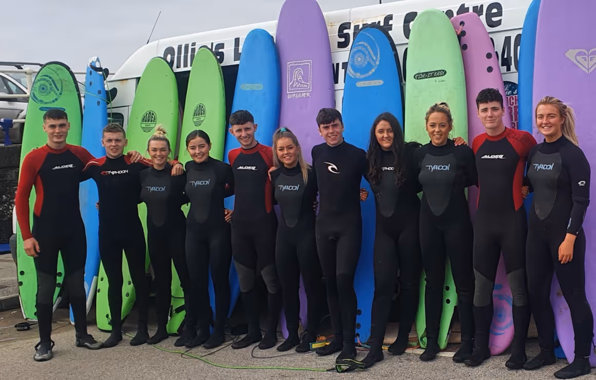 Ollie's Surf School on Lahinch beach men and women learning to surf