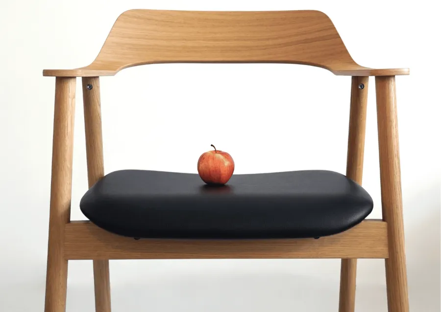 A Takt chair with a seat upholstered in Leap