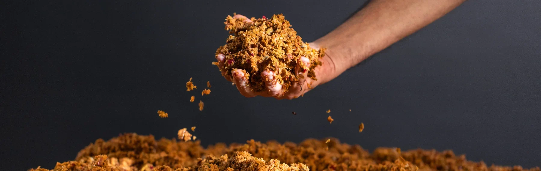 Apple pulp, the base material Leap is made from, falling from a hand onto the pile