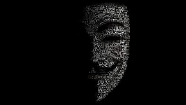 Hacker mask formed from code, representing cyber threats
