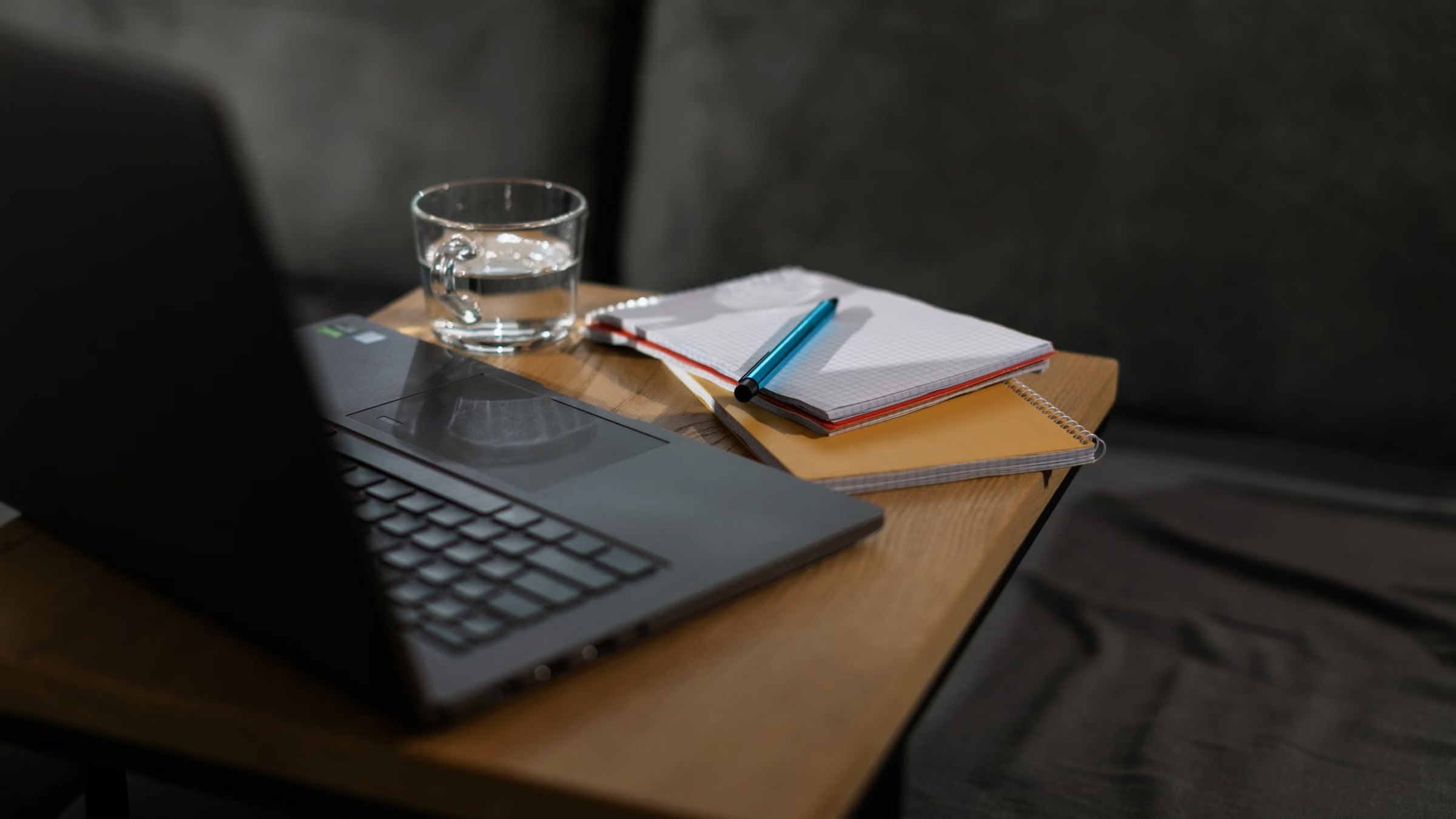 Laptop and notebooks on a desk