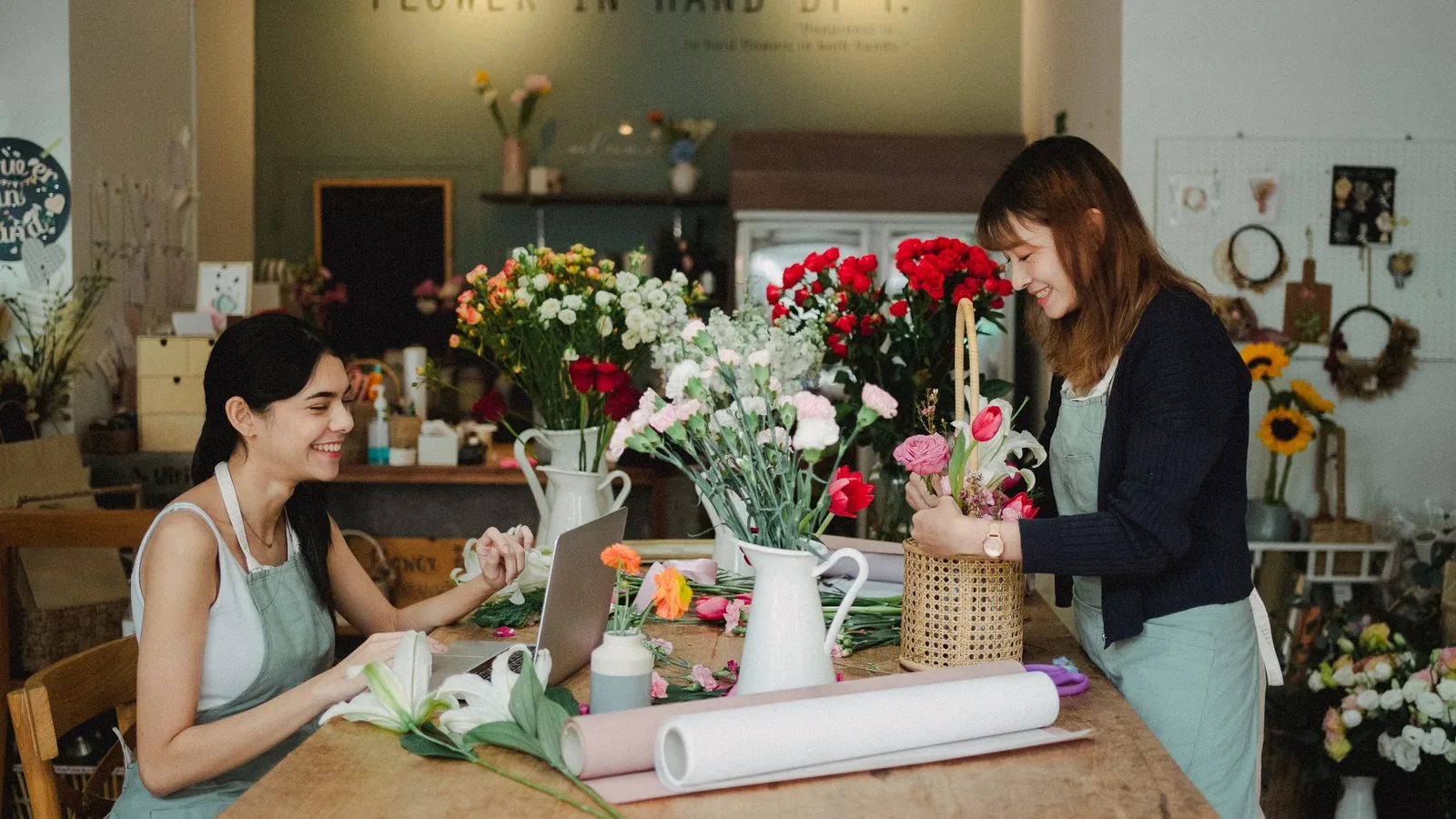 Small business owners working with a laptop in their shop