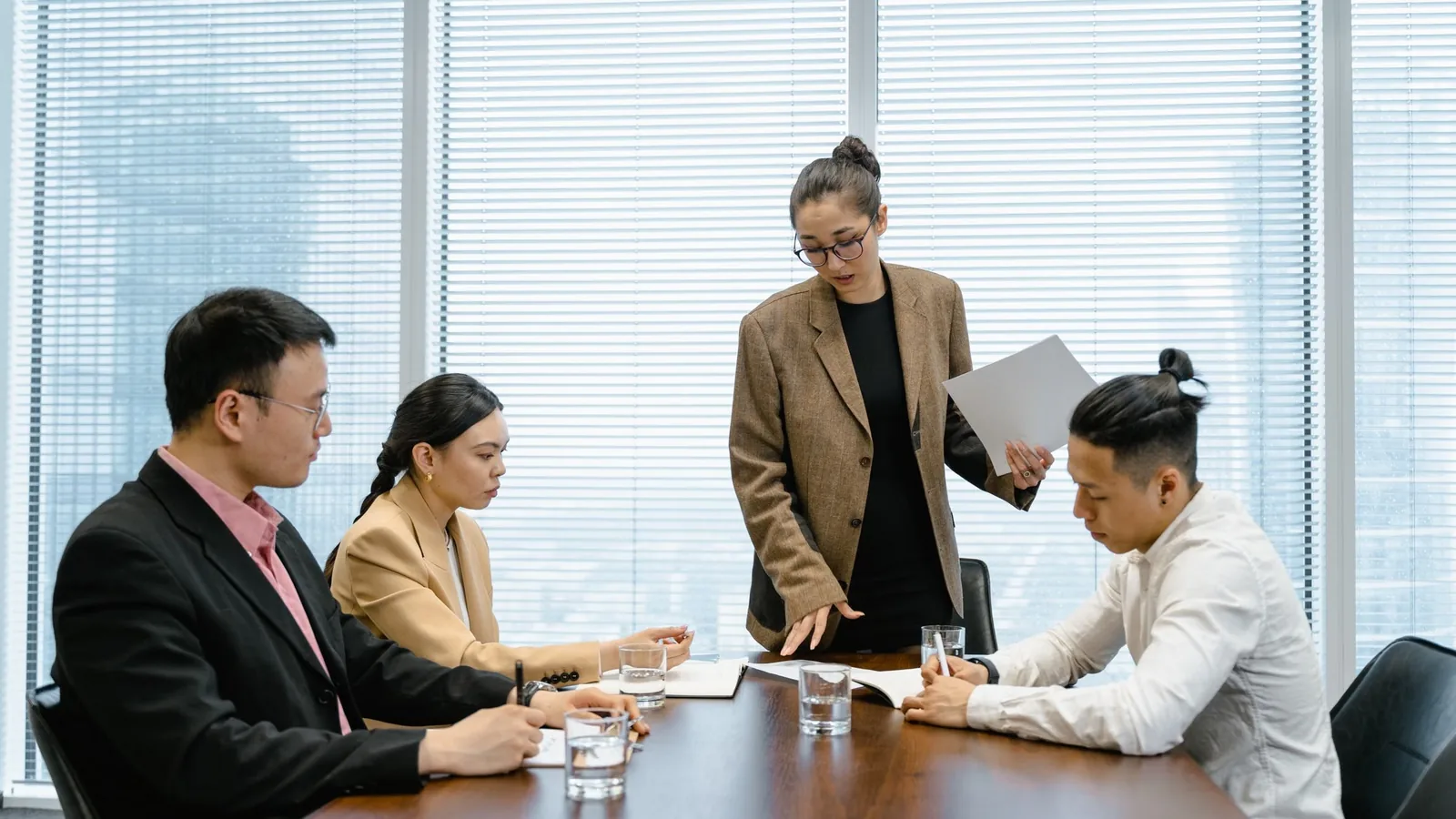 Colleagues in a meeting around a boardroom table