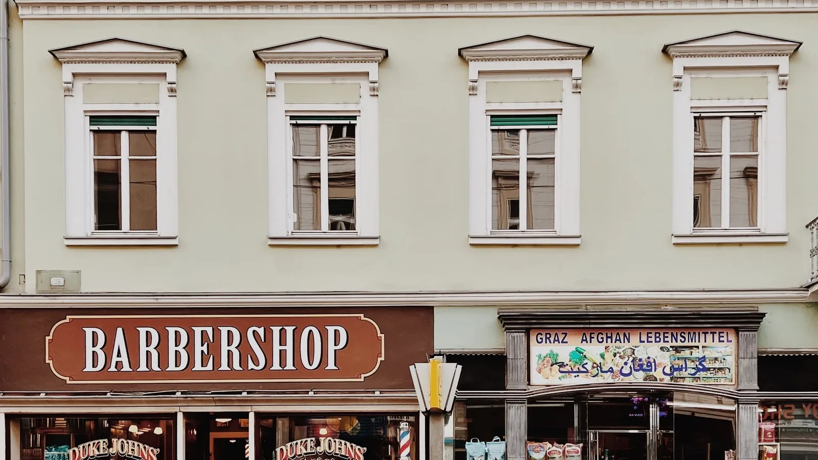 Row of independent shopfronts on a city street
