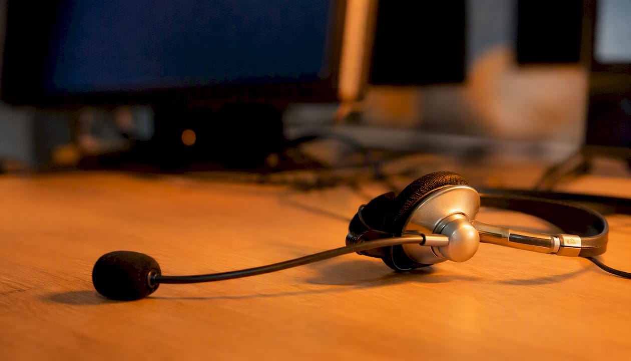 Call centre headset on desk close-up