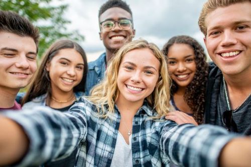 happy patient holding a water cup given by dentist