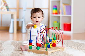 When Babies Start Playing With Toys ...