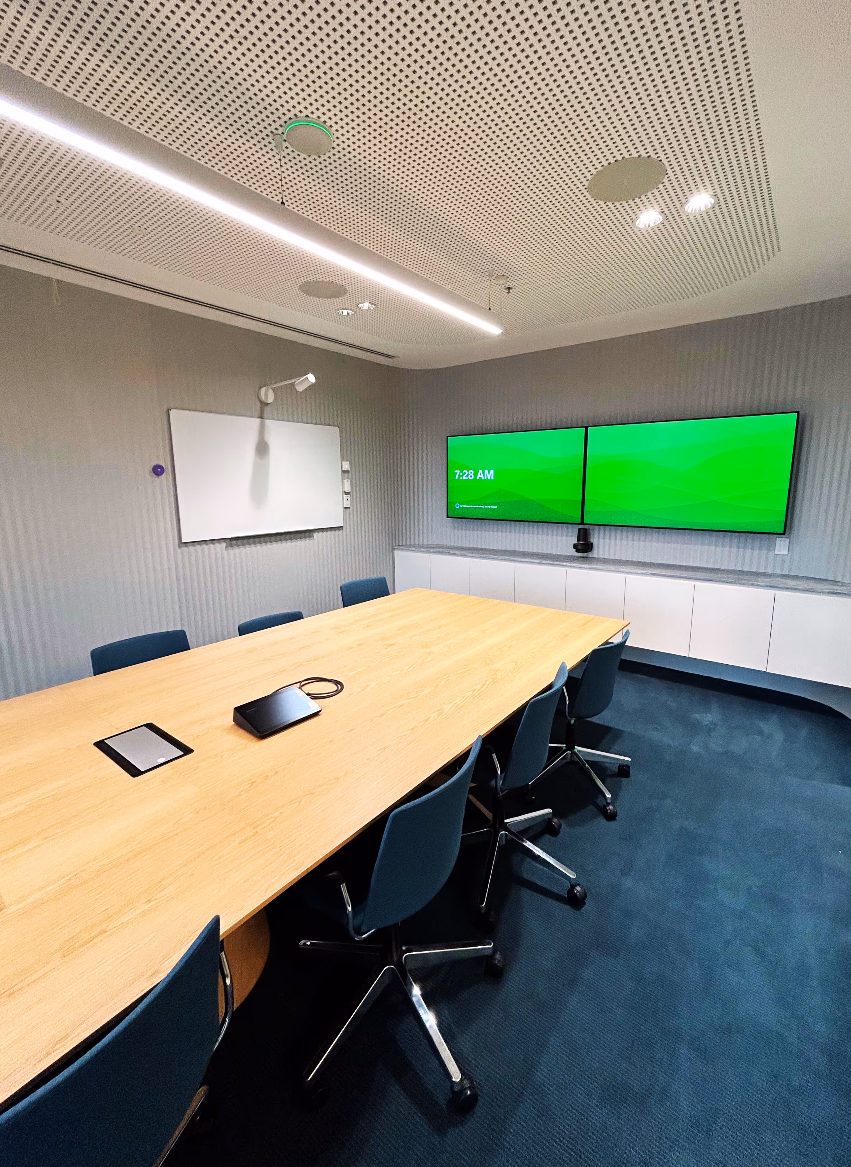 Large dual screen Microsoft Teams Room utilising Logitech hardware including Scribe whiteboard camera and biamp audio system