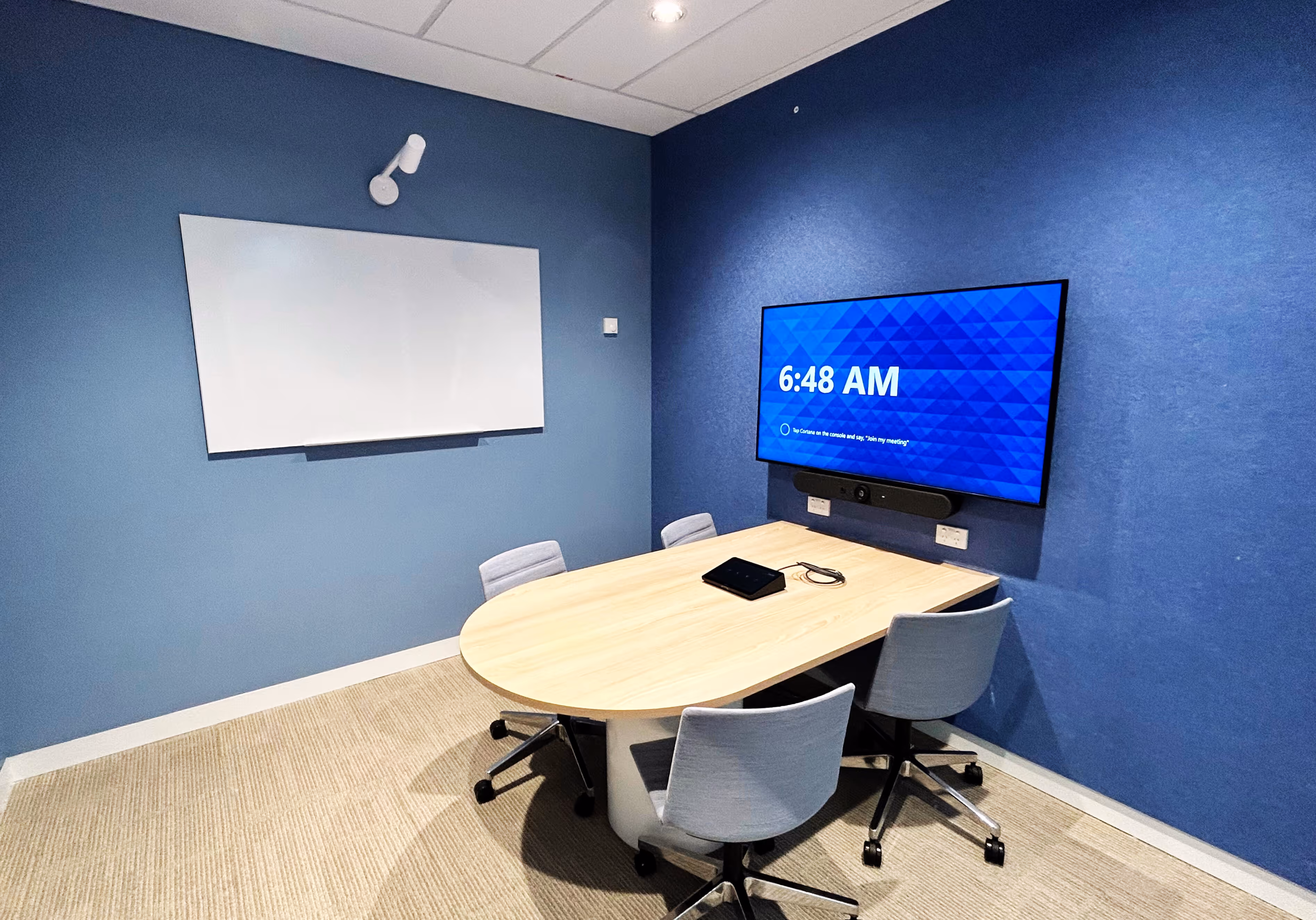 Small Microsoft Teams conference room utilising Logitech hardware including a Scribe whiteboard camera