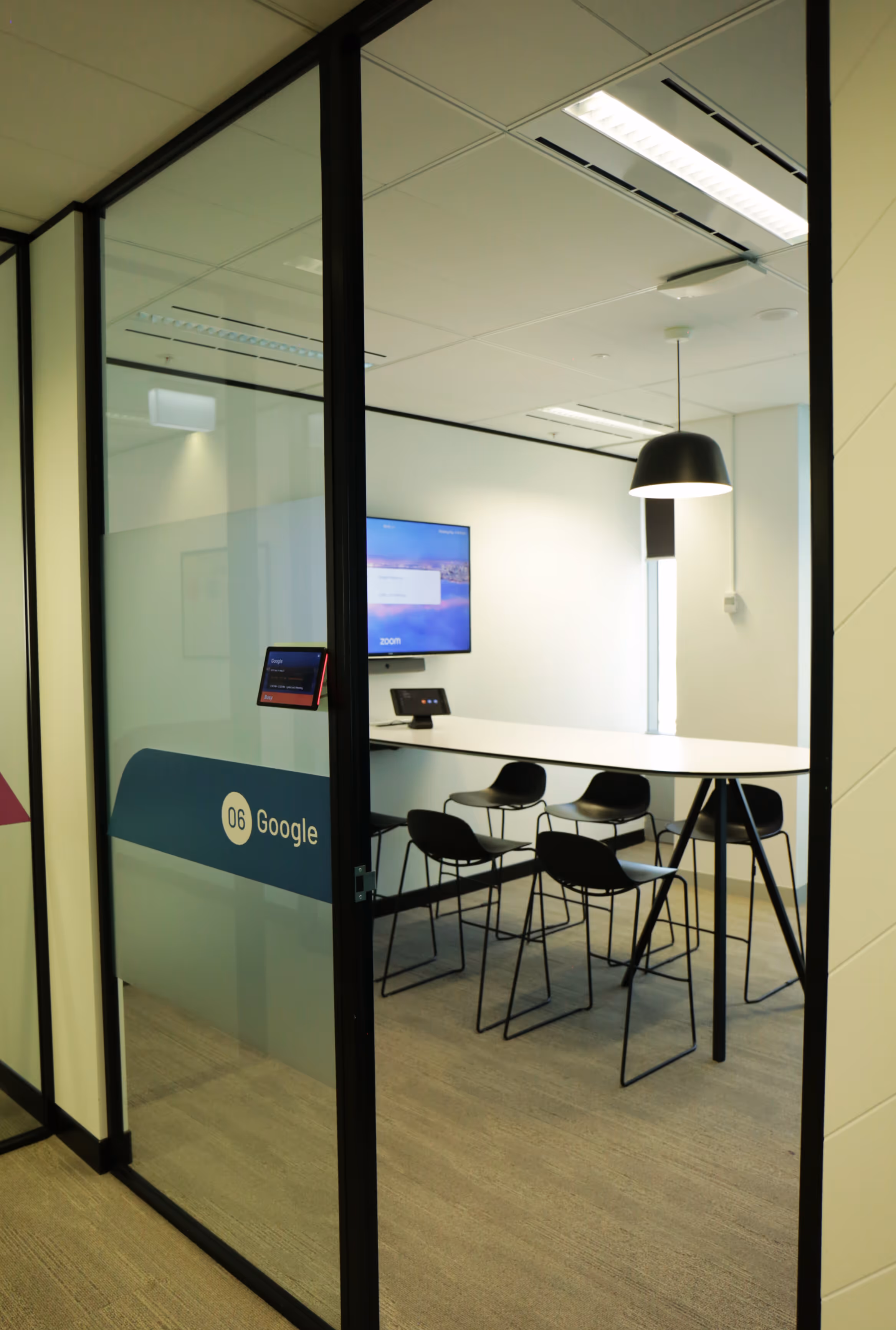 Small Zoom Room conference room utilising Neat and Apple hardware and Neat Pad as a scheduling display